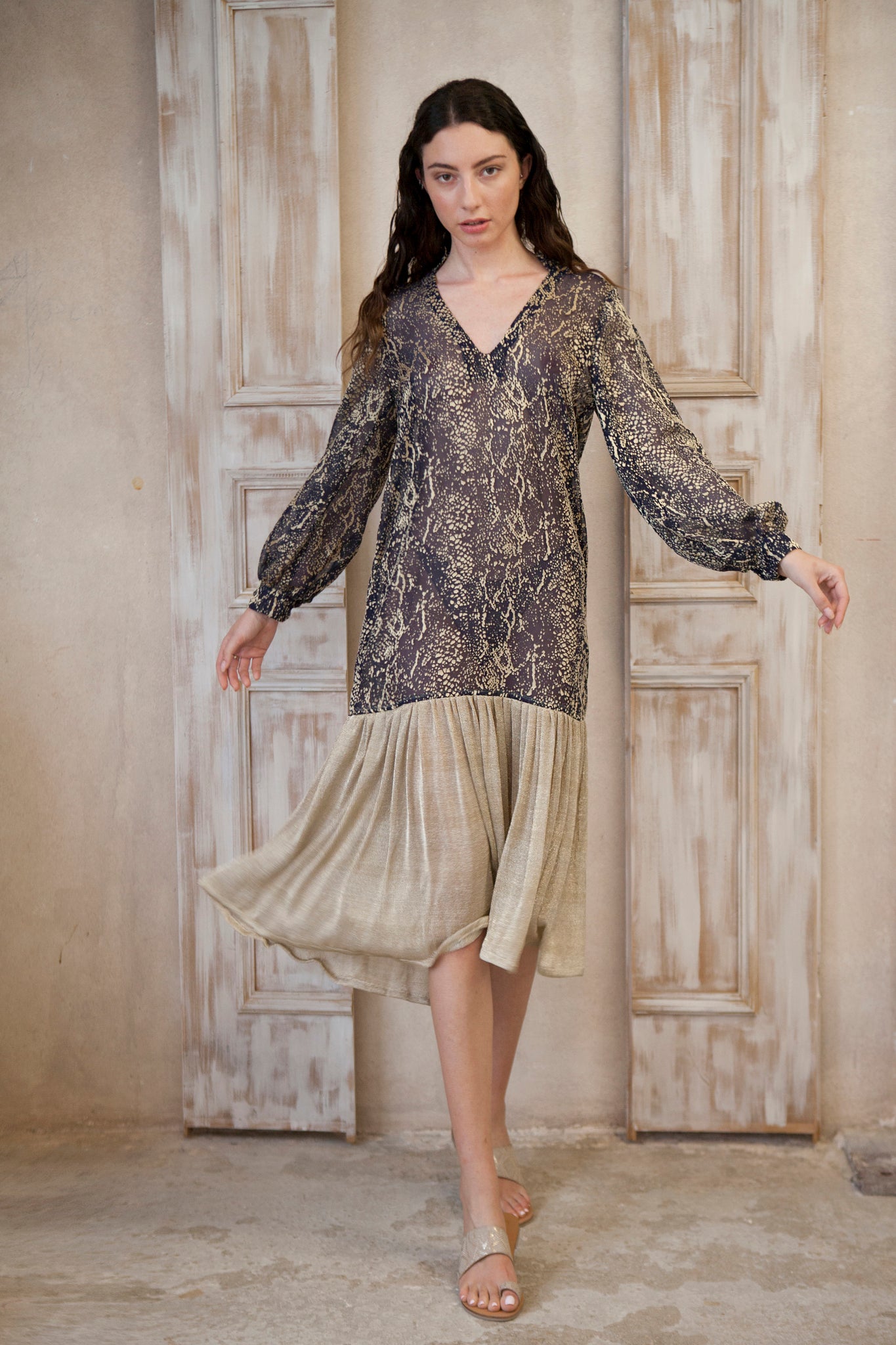 Relaxed fit, long sleeve gold-blue midi dress. The gold frill trim adds a touch of playful charm