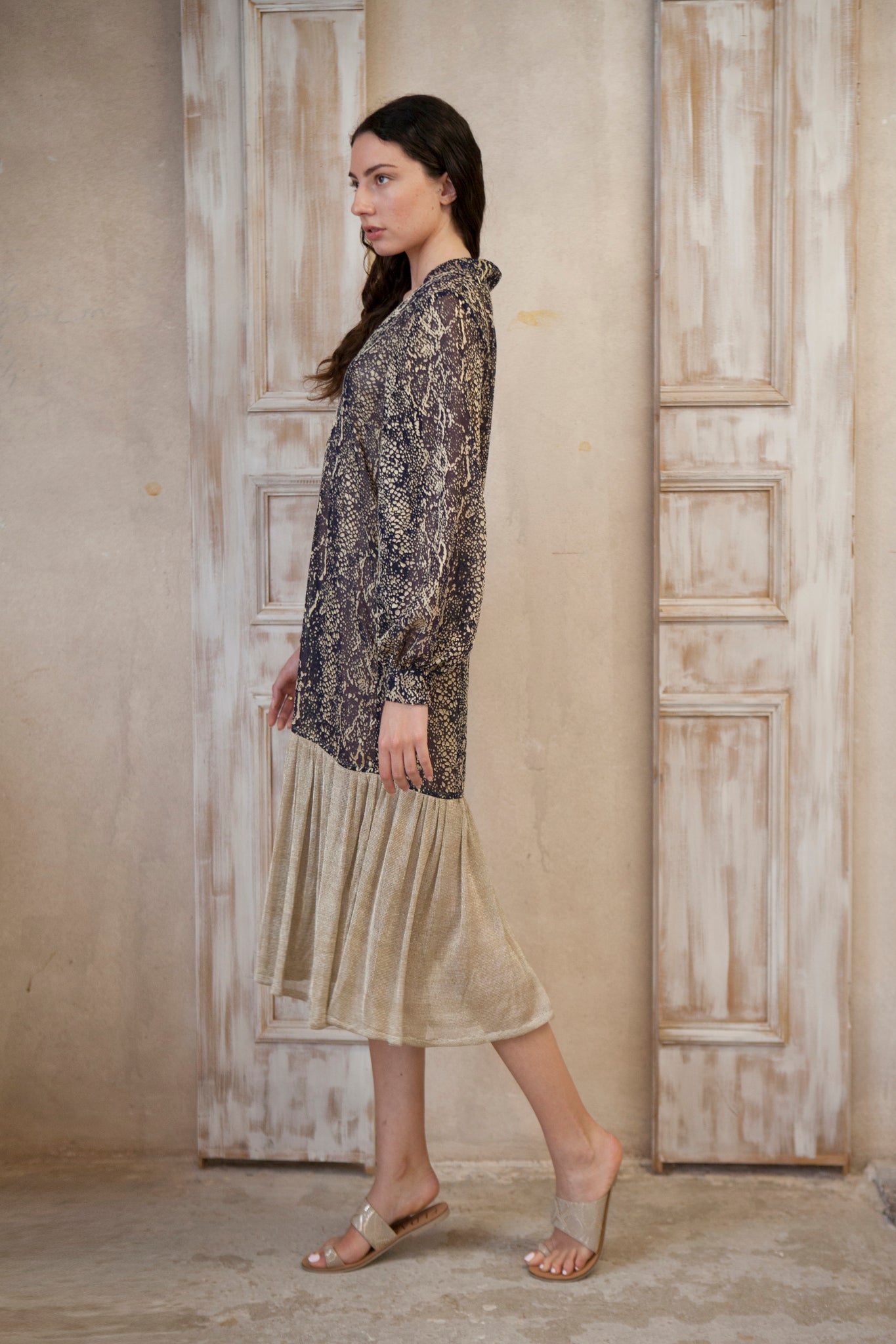 Relaxed fit, long sleeve gold-blue midi dress. The gold frill trim adds a touch of playful charm