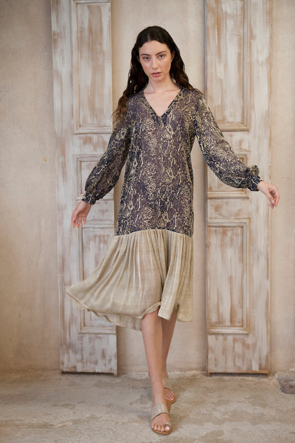 Relaxed fit, long sleeve gold-blue midi dress. The gold frill trim adds a touch of playful charm