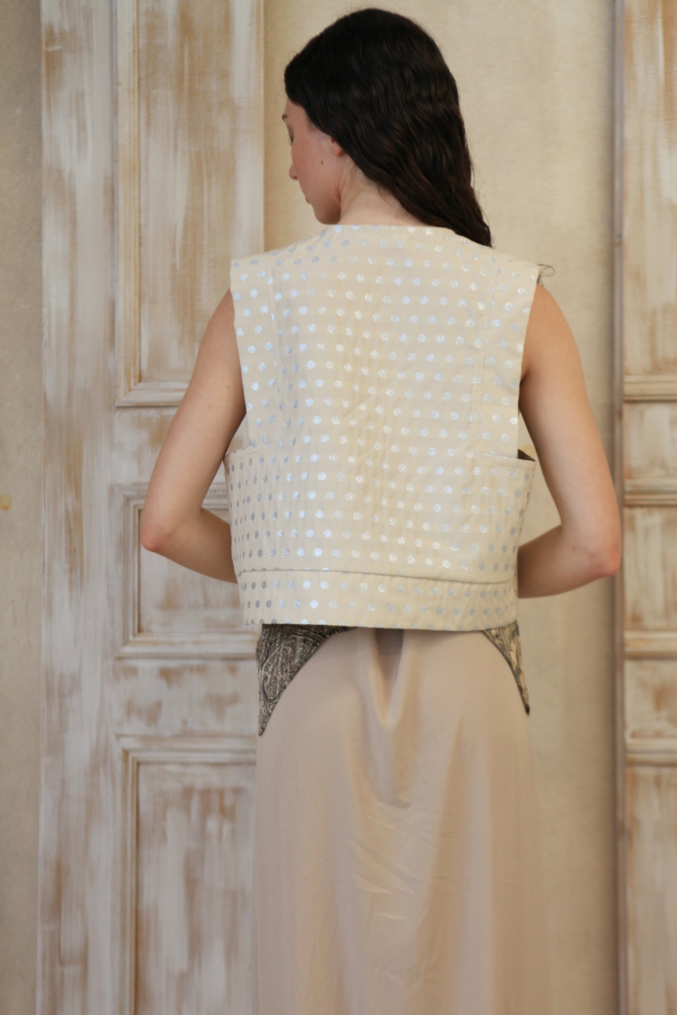 Boxy geometric girly vest in cream color with silver dots.