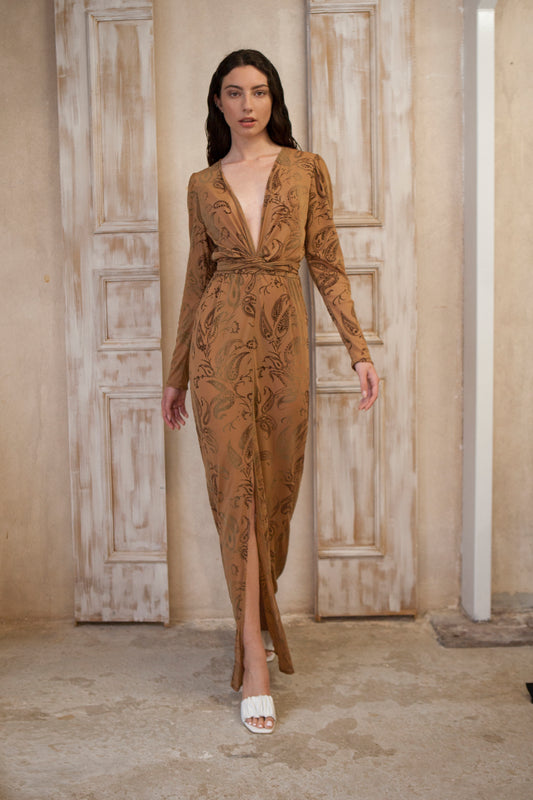 Long sleeve long wrap dress, featuring a captivating brown hue adorned with bold paisley prints.